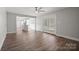 Open-concept living space features wood floors and a seamless transition to the kitchen and outdoors at 306 7Th Street Ne Pl, Conover, NC 28613