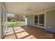 Inviting screened porch with fan, brick accents, and easy access to the outdoors at 306 7Th Street Ne Pl, Conover, NC 28613