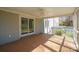 Cozy screened porch with tiled flooring, a ceiling fan, and views of the exterior yard at 306 7Th Street Ne Pl, Conover, NC 28613