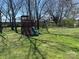Image of a playground with swings and a slide in the backyard at 312 Gold Hill Ave, Rockwell, NC 28138