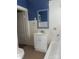 Bathroom featuring vintage white vanity, classic tiled walls, and a shower-tub combo at 312 Gold Hill Ave, Rockwell, NC 28138