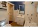 Cozy bathroom with tiled walls, a classic vanity, and neutral accents at 312 Gold Hill Ave, Rockwell, NC 28138