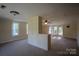 Spacious bedroom with a dividing wall, carpet and plenty of natural light at 312 Gold Hill Ave, Rockwell, NC 28138