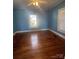 Spacious bedroom featuring hardwood floors and natural light at 312 Gold Hill Ave, Rockwell, NC 28138