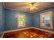 Serene bedroom with hardwood floors, bright natural light, and neutral walls at 312 Gold Hill Ave, Rockwell, NC 28138