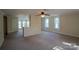 Spacious bedroom features neutral carpet and many windows bringing in natural light at 312 Gold Hill Ave, Rockwell, NC 28138