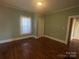 Sun-filled bedroom featuring hardwood floors, and a closet at 312 Gold Hill Ave, Rockwell, NC 28138