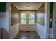 Cozy breakfast nook with natural light, wainscoting, and neutral paint scheme at 312 Gold Hill Ave, Rockwell, NC 28138