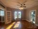 Sunny dining room with hardwood floors, a ceiling fan, and large windows for natural light at 312 Gold Hill Ave, Rockwell, NC 28138