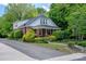 Charming brick home featuring a well-maintained lawn and mature trees at 312 Gold Hill Ave, Rockwell, NC 28138