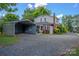 Charming two-story home with detached metal carport and lush landscaping at 312 Gold Hill Ave, Rockwell, NC 28138