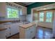 Bright kitchen with classic cabinetry, a butcher block island, and a garden view at 312 Gold Hill Ave, Rockwell, NC 28138