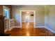 Open-concept living area with hardwood floors and charming built-in features at 312 Gold Hill Ave, Rockwell, NC 28138