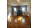 Charming living room featuring hardwood floors, a classic fireplace, and plenty of natural light at 312 Gold Hill Ave, Rockwell, NC 28138