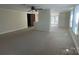 Open living area with large windows, neutral carpet, and brick half wall at 312 Gold Hill Ave, Rockwell, NC 28138