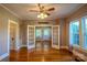 Bright and airy living area with hardwood floors, French doors, and ceiling fan at 312 Gold Hill Ave, Rockwell, NC 28138