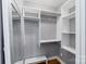 Walk-in closet offering ample storage with built-in shelves and hanging rods for organization at 3808 Severn Ave, Charlotte, NC 28210