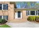 Inviting brick home entrance with brick steps, dark door, and well-maintained landscaping at 3808 Severn Ave, Charlotte, NC 28210