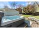 Backyard hot tub with lush lawn and patio area, creating a private outdoor retreat for relaxation and entertainment at 3808 Severn Ave, Charlotte, NC 28210