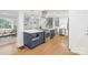 Bright kitchen with stainless steel appliances, custom cabinetry, and hardwood floors at 3808 Severn Ave, Charlotte, NC 28210