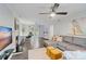 Open living space with a fireplace, comfortable sectional, and a stylish home office setup at 3808 Severn Ave, Charlotte, NC 28210