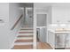 Bright home interior with staircase, wood floors, and white cabinets; open and airy design at 3808 Severn Ave, Charlotte, NC 28210