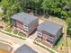 Aerial view of modern townhomes surrounded by lush greenery, showcasing the community's layout at 403 Old Town Village Rd, Waxhaw, NC 28173