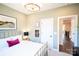 Light-filled bedroom with a gold bedframe, warm neutral paint, and white trim at 403 Old Town Village Rd, Waxhaw, NC 28173