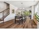 Dining area open to the living space, featuring hardwood floors and a staircase to the upper level at 403 Old Town Village Rd, Waxhaw, NC 28173