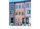 Three-story brick townhouse with black framed windows and doors, surrounded by modern landscaping at 403 Old Town Village Rd, Waxhaw, NC 28173