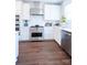 Modern kitchen featuring stainless steel appliances, white cabinets, and stylish subway tile backsplash at 403 Old Town Village Rd, Waxhaw, NC 28173