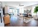 Bright living room with hardwood floors, a ceiling fan and sliding doors leading to a balcony at 403 Old Town Village Rd, Waxhaw, NC 28173