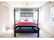 Elegantly designed main bedroom featuring a canopy bed with a bench and large windows at 403 Old Town Village Rd, Waxhaw, NC 28173