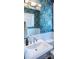 Charming powder room featuring colorful wallpaper and a modern sink with stylish fixtures at 403 Old Town Village Rd, Waxhaw, NC 28173