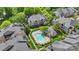 A beautiful community featuring a sparkling pool, lush landscaping, and well-maintained buildings at 5001 Sharon Rd # H, Charlotte, NC 28210
