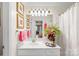 Classic bathroom featuring a vanity with ample lighting, decorative accents, and a shower with curtain at 5001 Sharon Rd # H, Charlotte, NC 28210