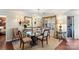 Formal dining room featuring a glass-topped table and a traditional chandelier at 5001 Sharon Rd # H, Charlotte, NC 28210