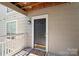 Inviting entrance with a well-maintained porch and a stylish front door, creating a welcoming first impression at 5001 Sharon Rd # H, Charlotte, NC 28210