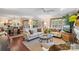Bright living room featuring hardwood floors, large windows, and stylish furnishings at 5001 Sharon Rd # H, Charlotte, NC 28210