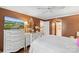Comfortable primary bedroom showcasing decorative white furniture, wood floors, and access to an ensuite bathroom at 5001 Sharon Rd # H, Charlotte, NC 28210