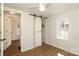 Bright bedroom featuring wood flooring, a ceiling fan and a sliding closet door at 517 Roberts Ave, York, SC 29745