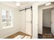 Sunlit bedroom featuring wood flooring and a sliding closet door at 517 Roberts Ave, York, SC 29745