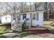 Inviting home boasting a lovely front porch, freshly landscaped yard, and a charming facade at 517 Roberts Ave, York, SC 29745