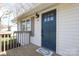 Close-up of the front entrance with a stylish blue door and well-maintained porch at 517 Roberts Ave, York, SC 29745