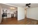 Open-concept kitchen with stainless steel appliances and newly installed laminate floors at 517 Roberts Ave, York, SC 29745