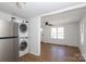 A view of the refrigerator and stacked washer and dryer units at 517 Roberts Ave, York, SC 29745