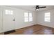Bright living room with wood floors, natural light from the new windows, and a ceiling fan at 517 Roberts Ave, York, SC 29745
