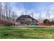 Expansive backyard with patio, screened porch, and lush green lawn, perfect for outdoor living at 518 May Green Dr, Clover, SC 29710