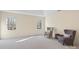 Spacious bedroom with neutral carpet and two upholstered chairs at 518 May Green Dr, Clover, SC 29710