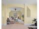 Inviting bonus room with arched doorway, plush seating, and abundant natural light at 518 May Green Dr, Clover, SC 29710
